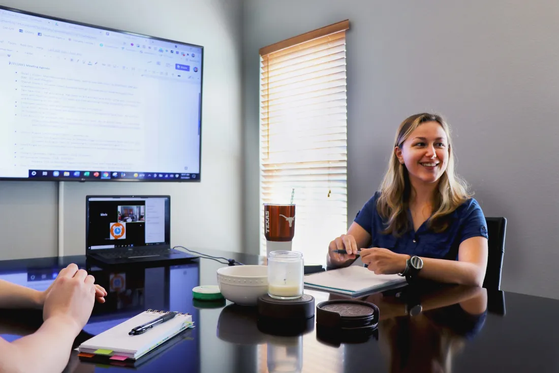 A No Time for Social team meeting in the Round Rock office